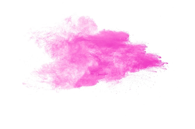 Explosion de particules de poussière rose sur fond blancMouvement figé d'éclaboussures de poudre rose