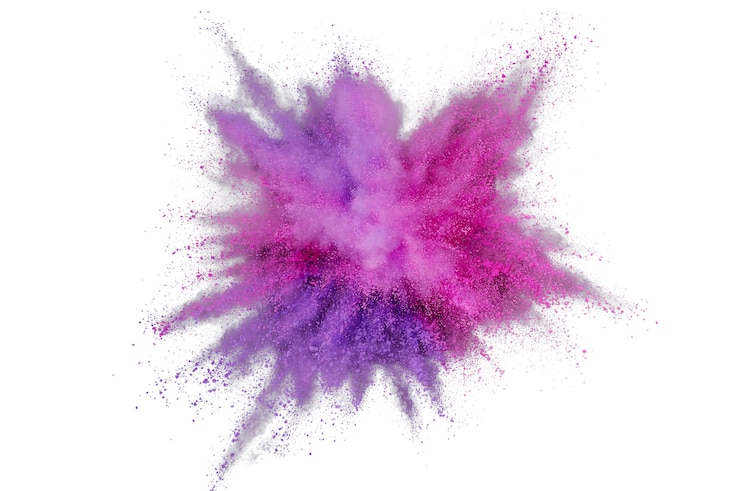Photo explosion de poudre colorée sur fond blanc. gros plan abstrait poussière sur toile de fond. explosion colorée. peinture holi