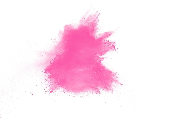 Explosion de poudre de couleur rose sur fond blanc. Lancement d&#39;éclaboussures de particules de poussière colorées.