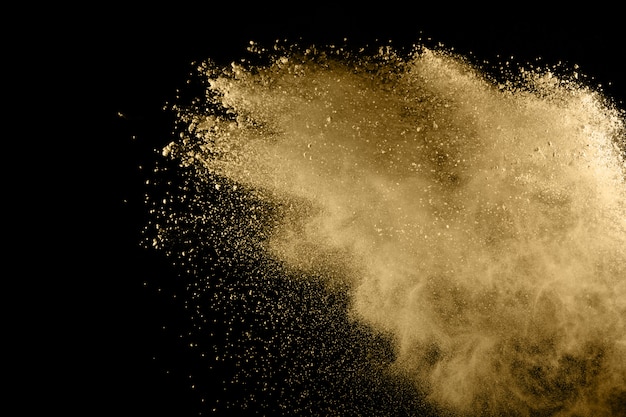 Explosion De Poudre Dorée Sur Fond Noir.