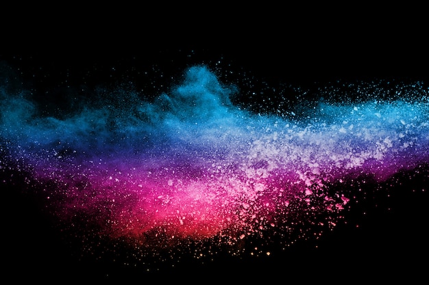 Photo explosion de poussière colorée abstraite sur fond noir.