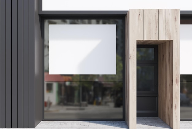 Façade de café en bois clair et gris foncé avec des affiches horizontales et une porte en verre.