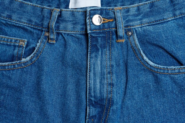 Face avant et poches de pantalons jeans bleus closeup background