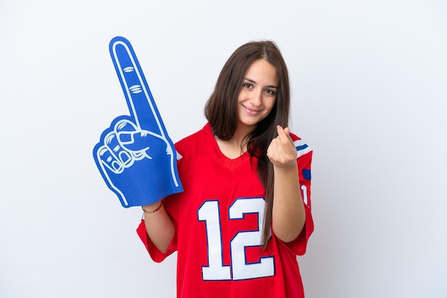 Fan de sport femme ukrainienne isolée sur fond blanc faisant un geste d'argent