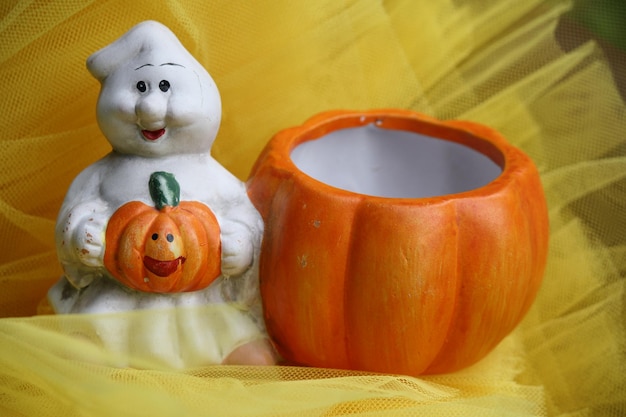 Photo un fantôme et une citrouille pour halloween.