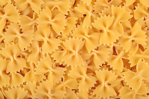 Farfalle de pâtes italiennes comme texture de fond