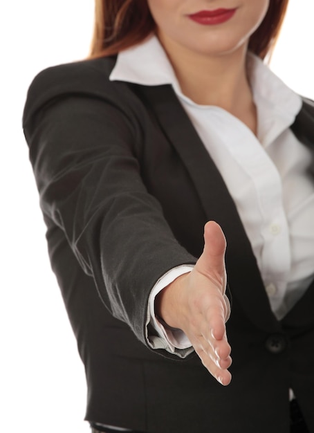 Photo une femme d'affaires donne la main sur un fond blanc.