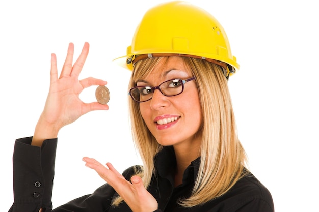 Femme d'affaires avec une pièce d'un dollar