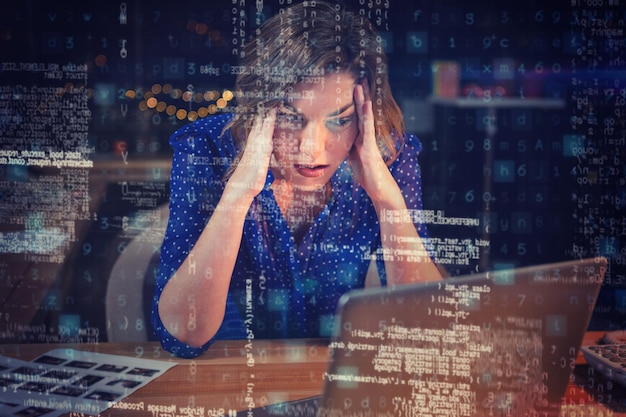 Femme d'affaires stressée assise au bureau 3D