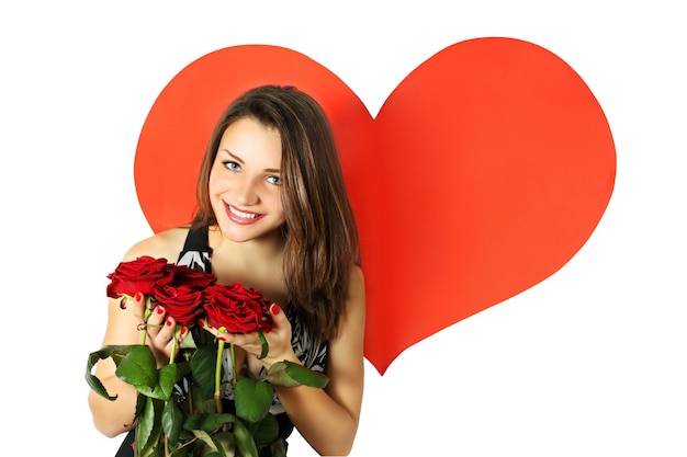 Femme avec un bouquet de roses sur fond de coeur