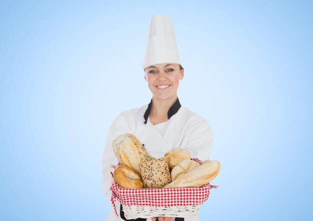 Femme chef avec du pain sur fond bleu