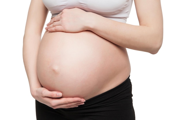 femme enceinte, tenue, ventre, à, bras, isolé, blanc