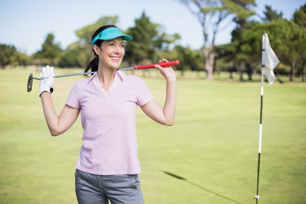 Femme heureuse, porter, club golf