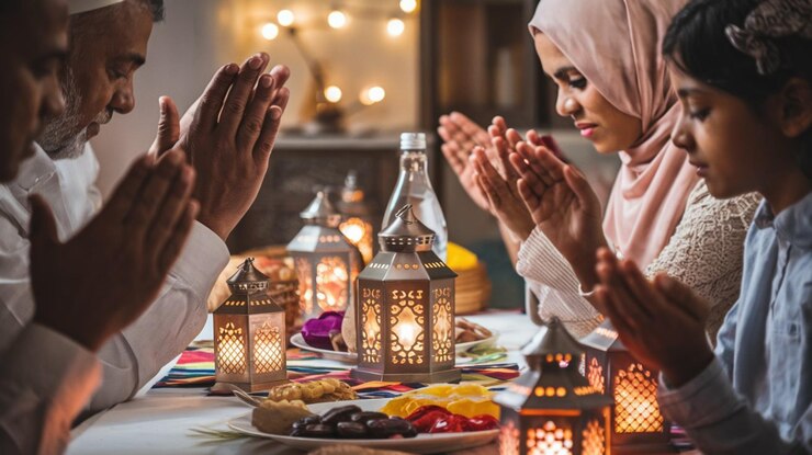 Photo une femme et un homme prient à une table avec des bougies et des lumières