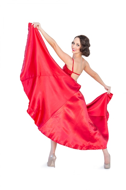 Femme magnifique souriante dansant le flamenco