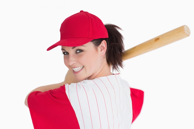 Femme prête à jouer avec une batte de baseball