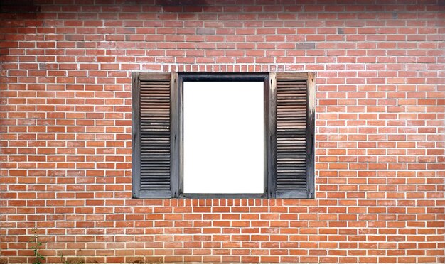 Photo fenêtre sur le mur de brique d'un bâtiment