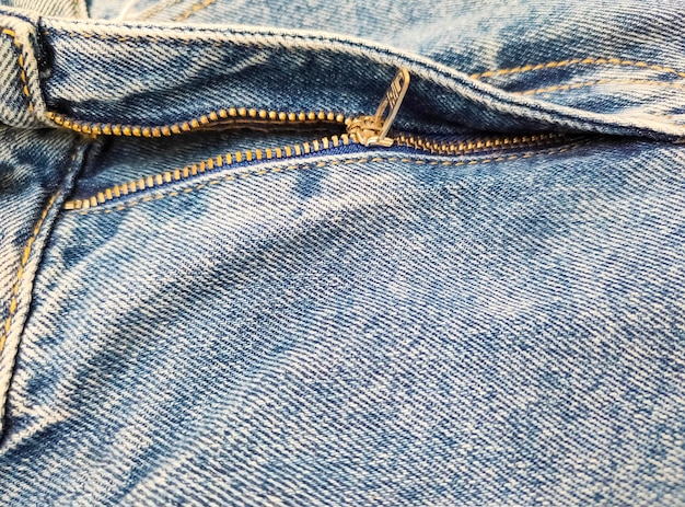 Fermeture à glissière sur jeans jeans texture closeup fond denim jeans décompressés