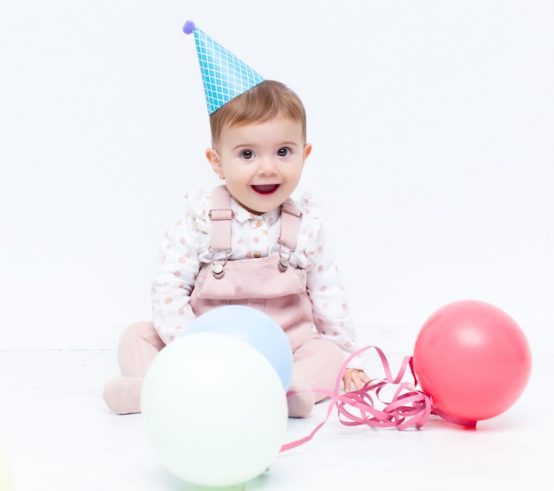 Photo fête d'anniversaire de bébé avec des ballons