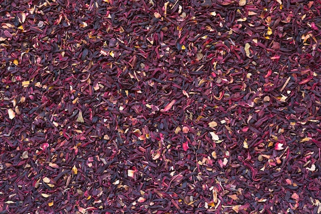 Feuilles de thé d'hibiscus coupé à sec en arrière-plan