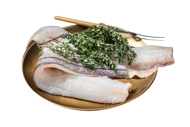 Filet de poisson blanc cru Poisson Haddock sur assiette avec romarin et thym isolé sur fond blanc Vue supérieure