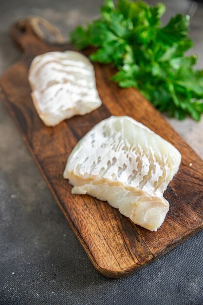 filet de poisson blanc de morue repas sain frais snack régime alimentaire sur la table copie espace arrière-plan alimentaire