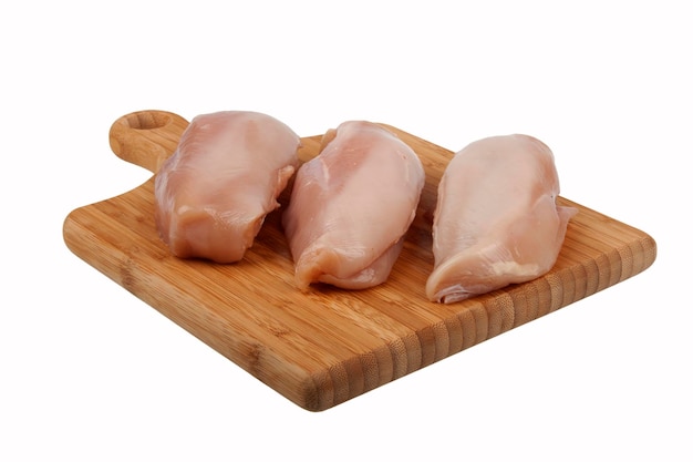 Photo filet de poulet sur une planche de cuisine