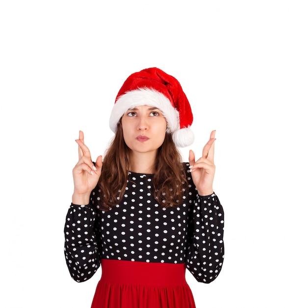 Photo fille émotive au chapeau de père noël