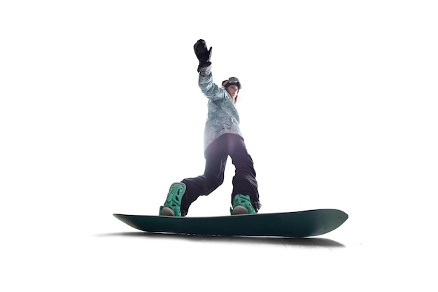 Fille de snowboarder en action isolé sur blanc