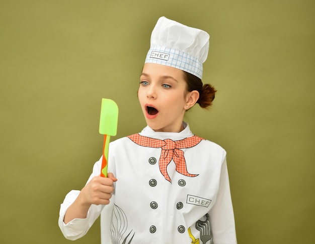 Une fille en tenue de chef Bannière de cuisine