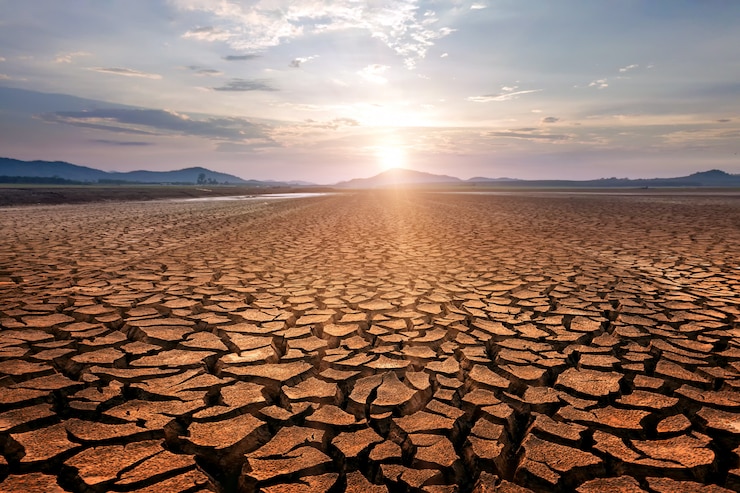 Photo fissures sèches dans le sol, graves pénuries d'eau