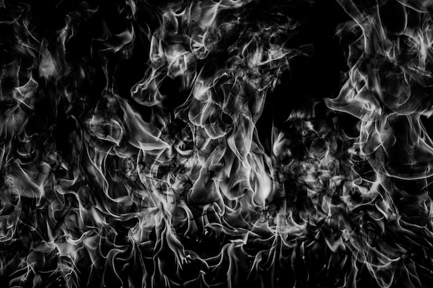 Flammes de flammes de feu sur fond noir Texture abstraite isolée de flamme de brûlure de feu Explosion enflammée avec effet de brûlure Modèle d'art abstrait de fond d'écran de feu