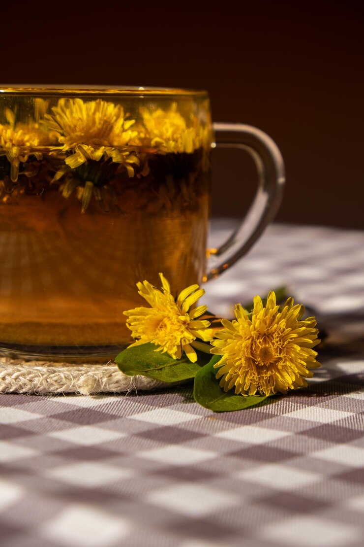 Photo fleur de pissenlit thé sain dans une tasse de verre sur la table médicament à base de plantes délicieux thé tisane de avec