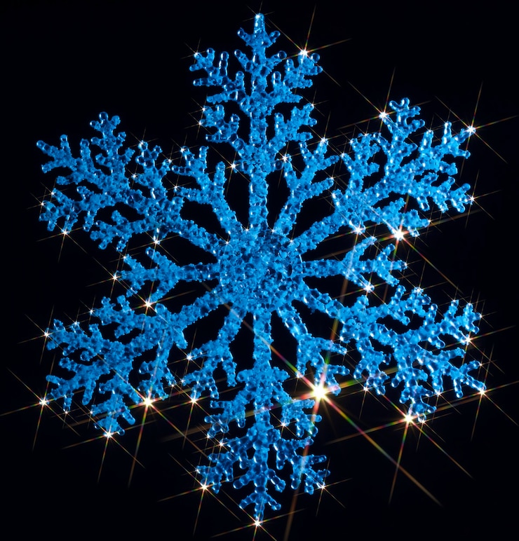 Photo un flocon de neige bleu étincelant