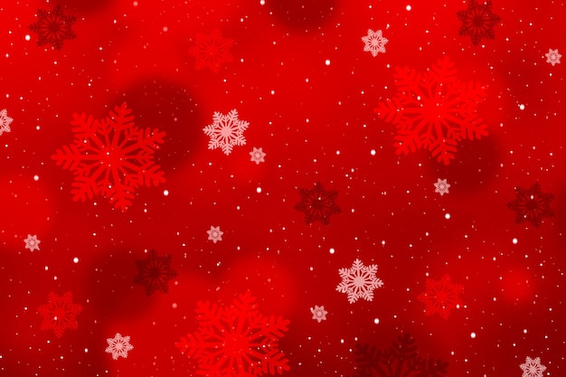 Des flocons de neige sur un fond rouge abstrait avec de l'espace pour votre texte