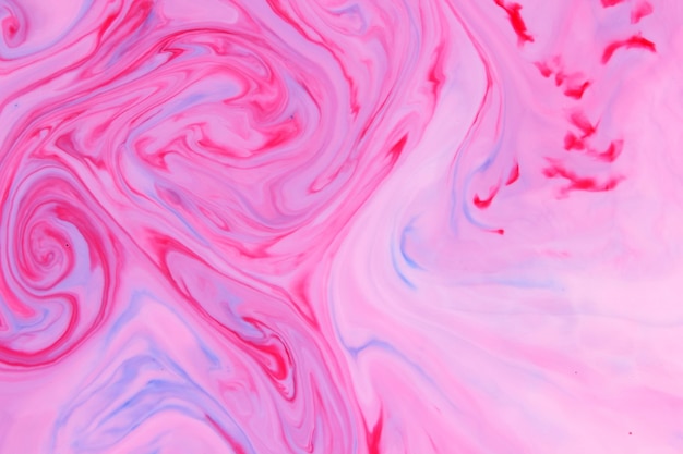 Fond abstrait bleu rose Taches roses sur liquide Fluid Art