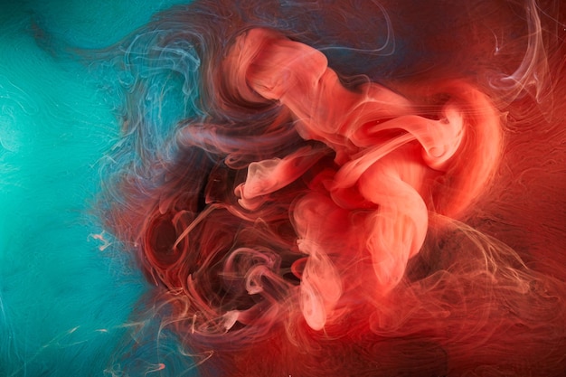 Fond abstrait d'encre rouge émeraude Toile de fond de peinture acrylique pour les cosmétiques de narguilé de parfum Nuages de fumée mystérieux brouillard coloré