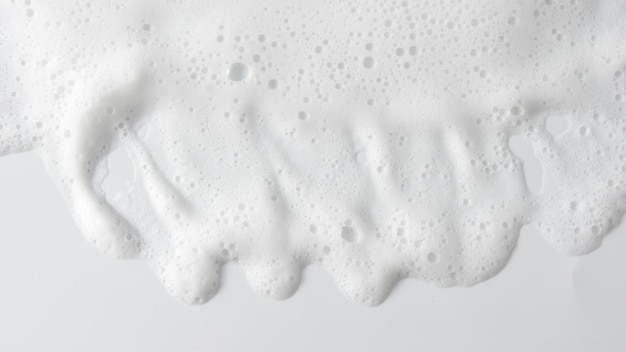 Fond abstrait texture mousse savonneuse blanche Mousse de shampooing avec bulles