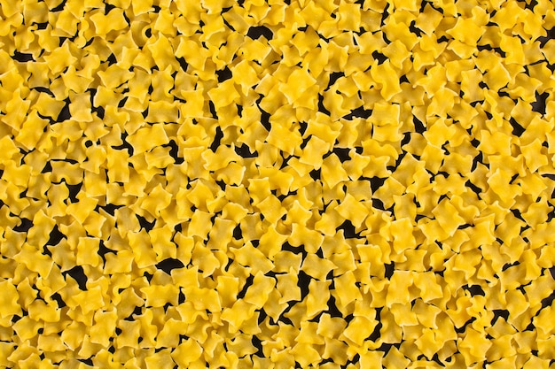 Fond d'aliments crus farfalle macaroni italien pâtes