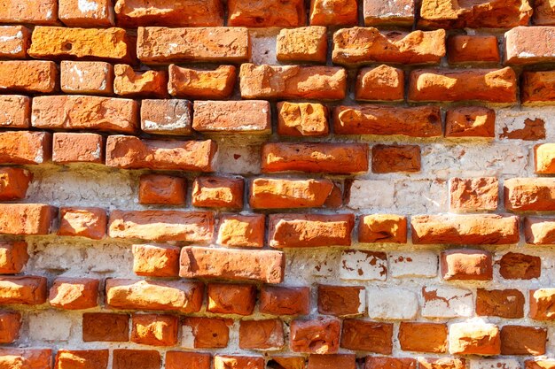 Fond de l'ancien mur de briques rouges