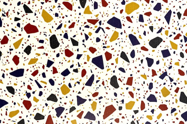 Un fond blanc avec un motif de galets de verre multicolores.