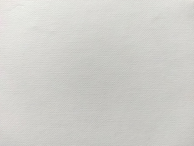 Photo un fond blanc avec un motif texturé d'un tissu texturé.