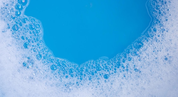Fond bleu à bulles de mousse de détergent