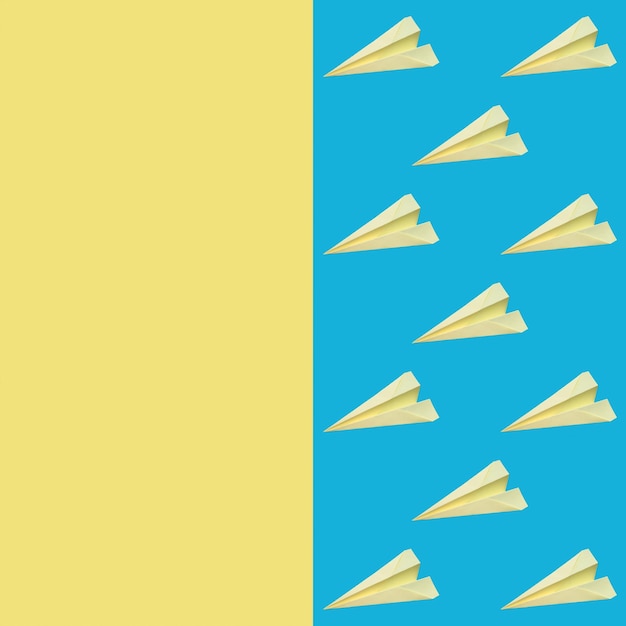 Photo sur un fond bleu un motif d'avions en papier jaune origami closeup papier peint et backg jaune