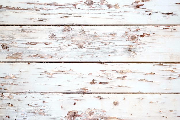 Fond de bois blanc vintage - vieille planche de bois patiné peint en couleur blanche.