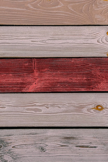 Fond en bois avec des planches beiges et rouges