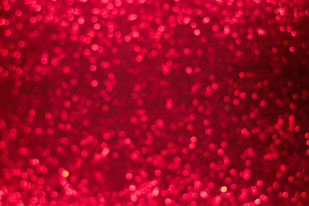 Fond de bokeh rouge brillant de vacances, paillettes, scintille, lueur défocalisé