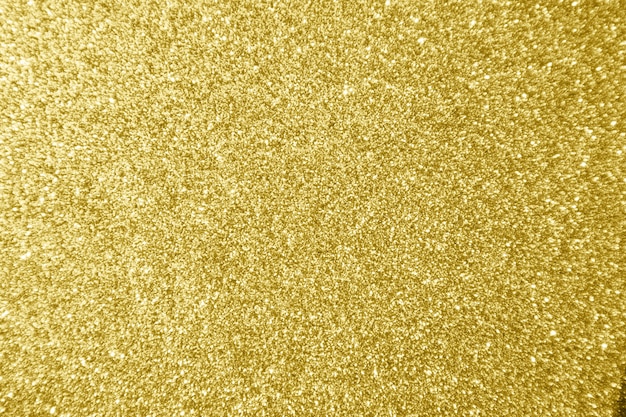 Fond clair de bokeh d'éclat de paillettes d'or abstrait