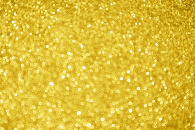 Fond clair de bokeh d'éclat de paillettes d'or abstrait