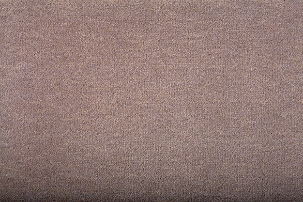 Fond de couverture de tapis. Motif et texture du tapis de couleur marron clair. Espace copie